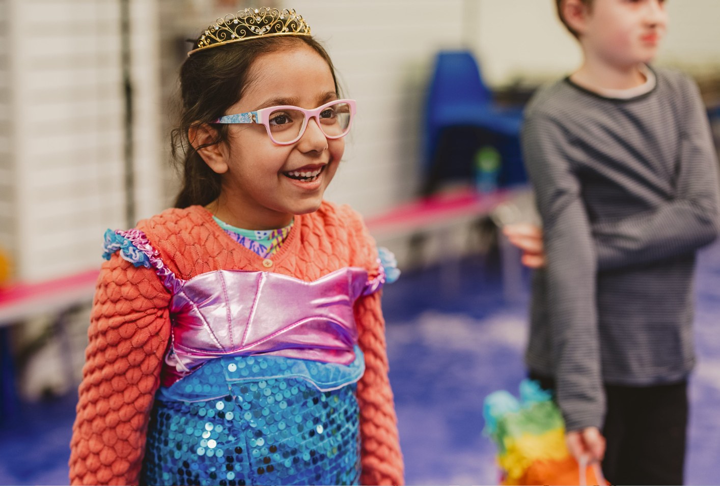 Girl in a princess costume laughing